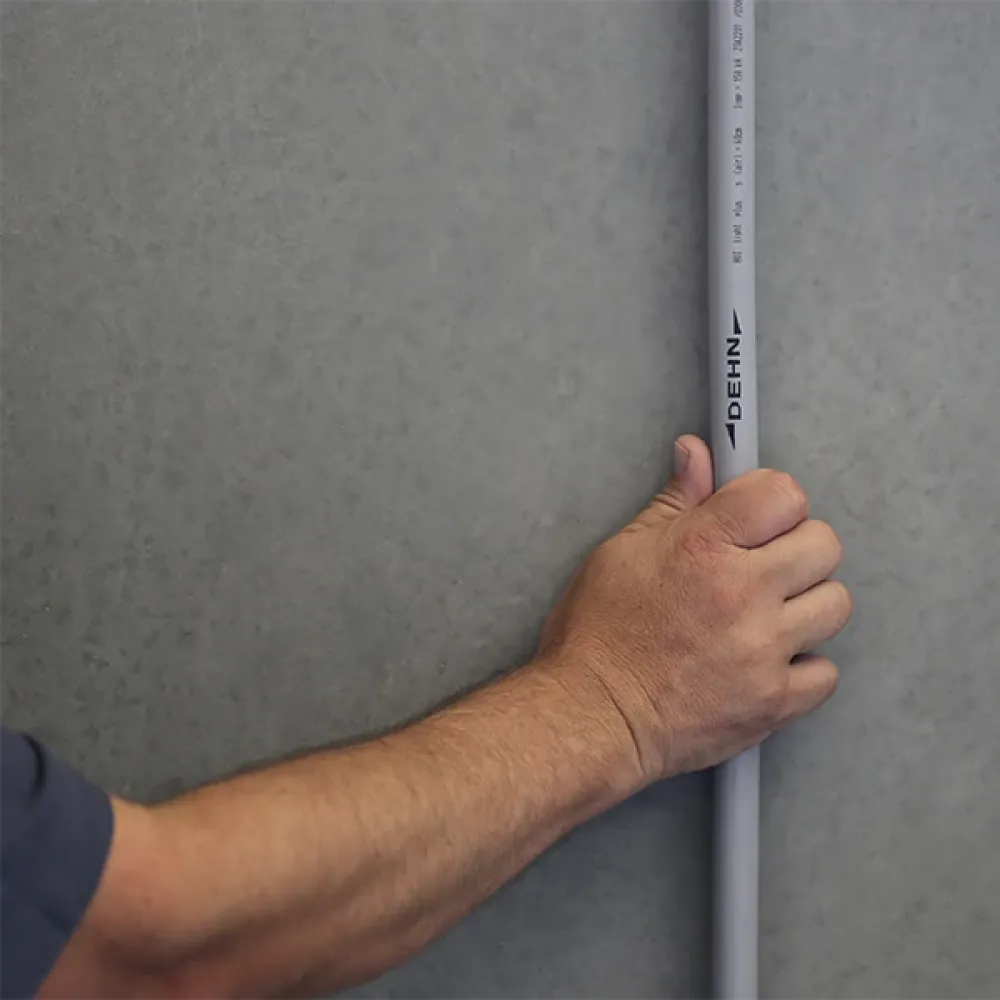 A hand holding a HVI light plus conductor