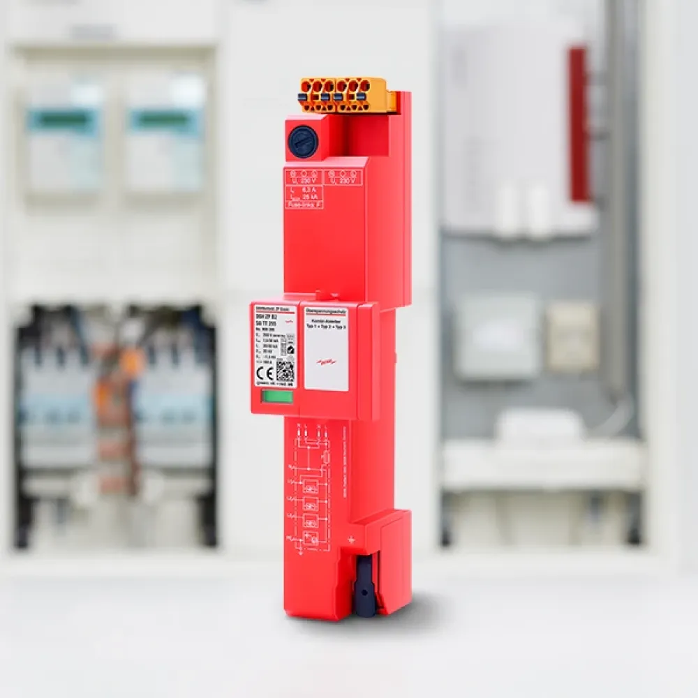 Rotes elektronisches Gerät mit Anschlüssen in technischer Umgebung.